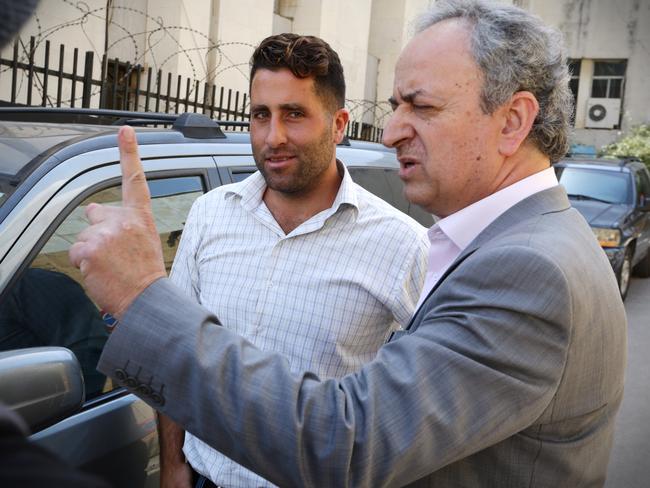 Ali Elamine lets his lawyer Hussein Berjawi do the talking when leaving the Palace of Justice, Baabda, Lebanon. Picture: Liam Kidston