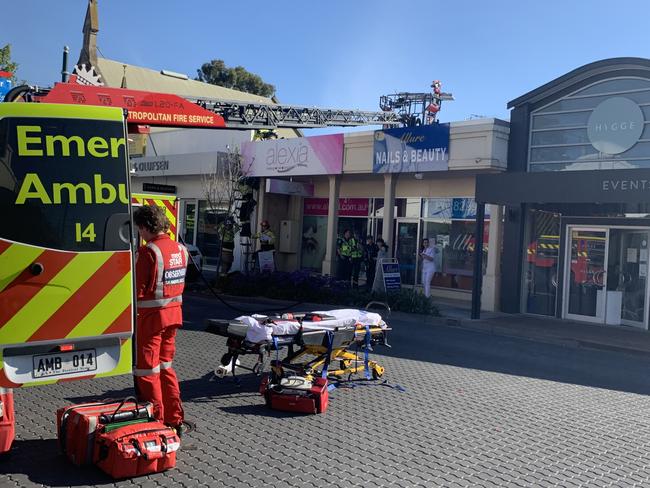 MFS crews work to rescue the man from the roofspace. Picture Tricia Watkinson