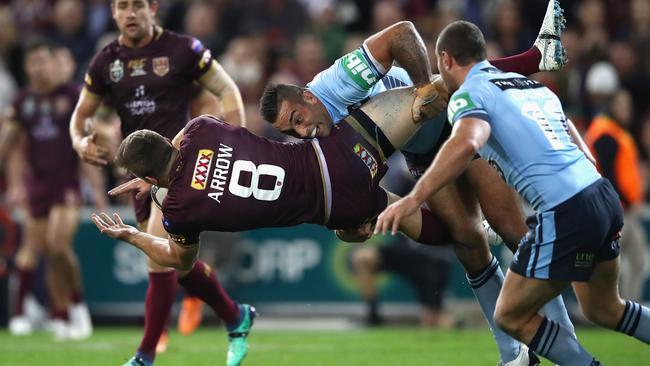 Jai Arrow gets roughed up by Paul Vaughan. (Mark Kolbe/Getty Images)