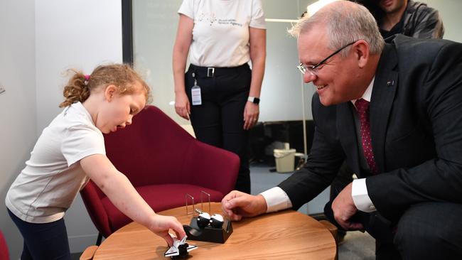 Mr Morrison with Skye, 4, during a tour of the new Australian Space Agency HQ. Picture: AAP / David Mariuz