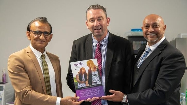 Mr Khan, left, with Labor’s then minister for disability services, Craig Crawford, centre, in June 2023.