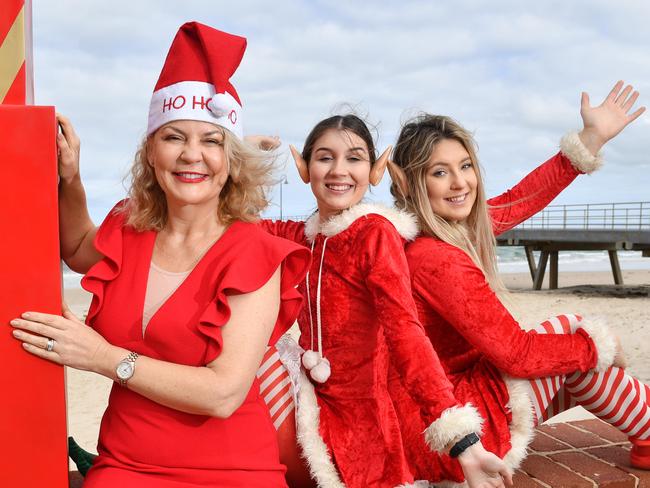 The City of Holdfast Bay Major Amanda Wilson, and elves Isabel Salter and Yasmin Hardy pose for a photograph at Glenelg, Adelaide on Thursday the 14th of November 2019. They are getting ready for the Glenelg Christmas Pageant, which is on Sunday the 24th of November. (AAP/ Keryn Stevens)