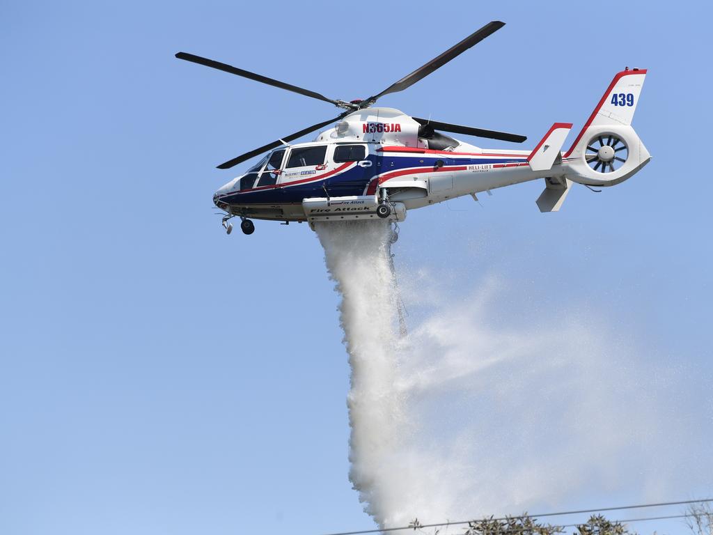 Helicopters dump water on the fire near Peregian