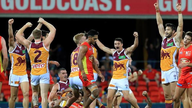 Brisbane players celebrate after the final siren. Picture: Adam Head