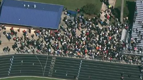 Students are evacuated after a teen gunman killed four people at a high school in Georgia. Picture: Supplied