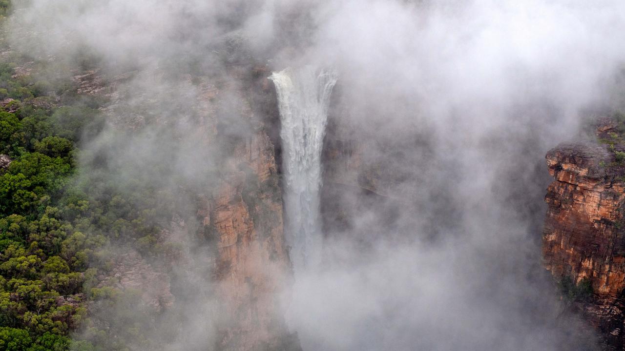 Kakadu National Park comes alive during the wet season. Kakadu Air are celebrating their 40th anniversary of flying in the Territory and relish the opportunity to show the NT News a new perspective of the park after rainfall. Jim Jim Falls is shrouded in cloud in the morning light. Picture: Che Chorley