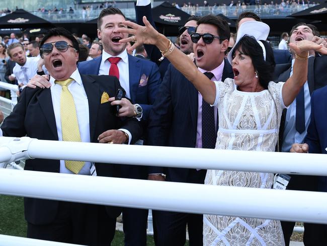 Bert Vieira (left) and his wife Gai celebrate their horse Trapeze Artist winning a race in April. Picture: AAP Image/David Moir