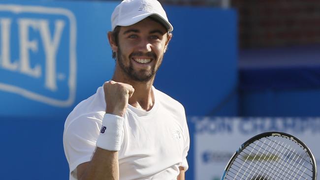 Jordan Thompson of Australia celebrates after winning match point against Andy Murray.