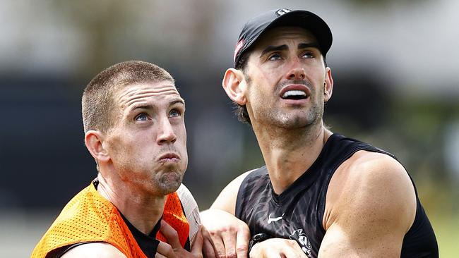 Brodie Grundy (right) tangles with Darcy Cameron during a pre-season training session. Picture: Daniel Pockett/Getty Images