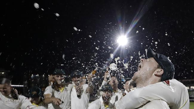 APAC Sports Pictures of the Week - 2019, September 9 - MANCHESTER, ENGLAND - SEPTEMBER 08: Steve Smith of Australia celebrates with team mates while singing the team song on the pitch after Australia claimed victory to retain the Ashes during day five of the 4th Specsavers Test between England and Australia at Old Trafford on September 08, 2019 in Manchester, England. (Photo by Ryan Pierse/Getty Images)