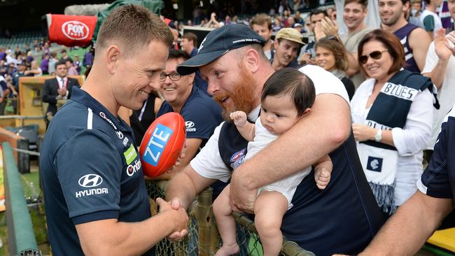 Carlton coach Brendon Bolton has a chat with a Blues fan.