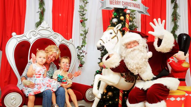 15th December 2020 – Nanna Debbie Chaperons with grand children Kobie (4) and Airlie (2) get their Covid Santa photos at The Pines Shopping Centre, Elanora. Photo: Scott Powick Newscorp