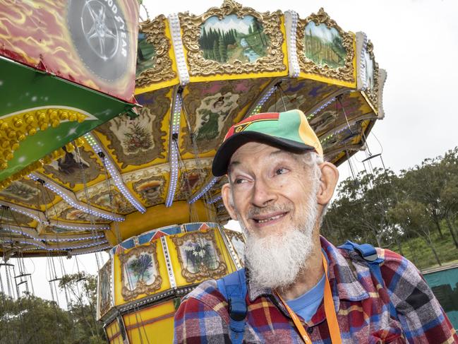 Photographer Robert Brown explores sideshow alley on day 3 of the Toowoomba Royal Show. Sunday, March 27, 2022. Picture: Nev Madsen.