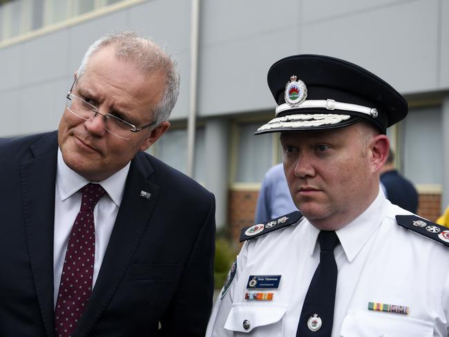 Prime Minister Scott Morrison with RFS Commissioner Shane Fitzsimmons at a visit to HMAS Albatross in Nowra on Sunday. Picture: AAP/Lukas Coch