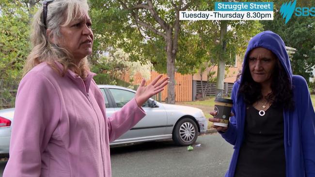 Norma Boyd with a friend after her eviction by a large group of police from her house.