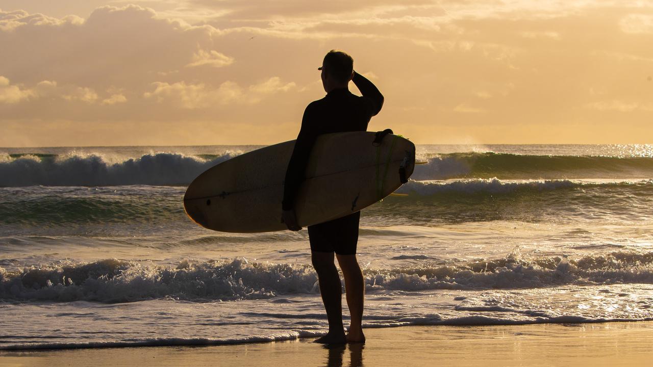 A surfer at Currumbin Beach on the Gold Coast. Picture: Nigel Hallett