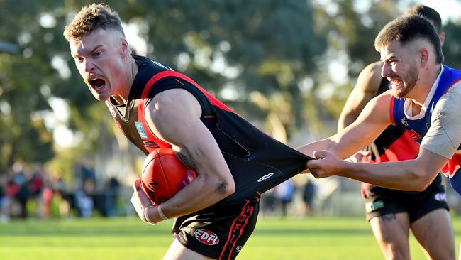 Rhys Ritchie tries to escape the tackle. Picture: Josh Chadwick