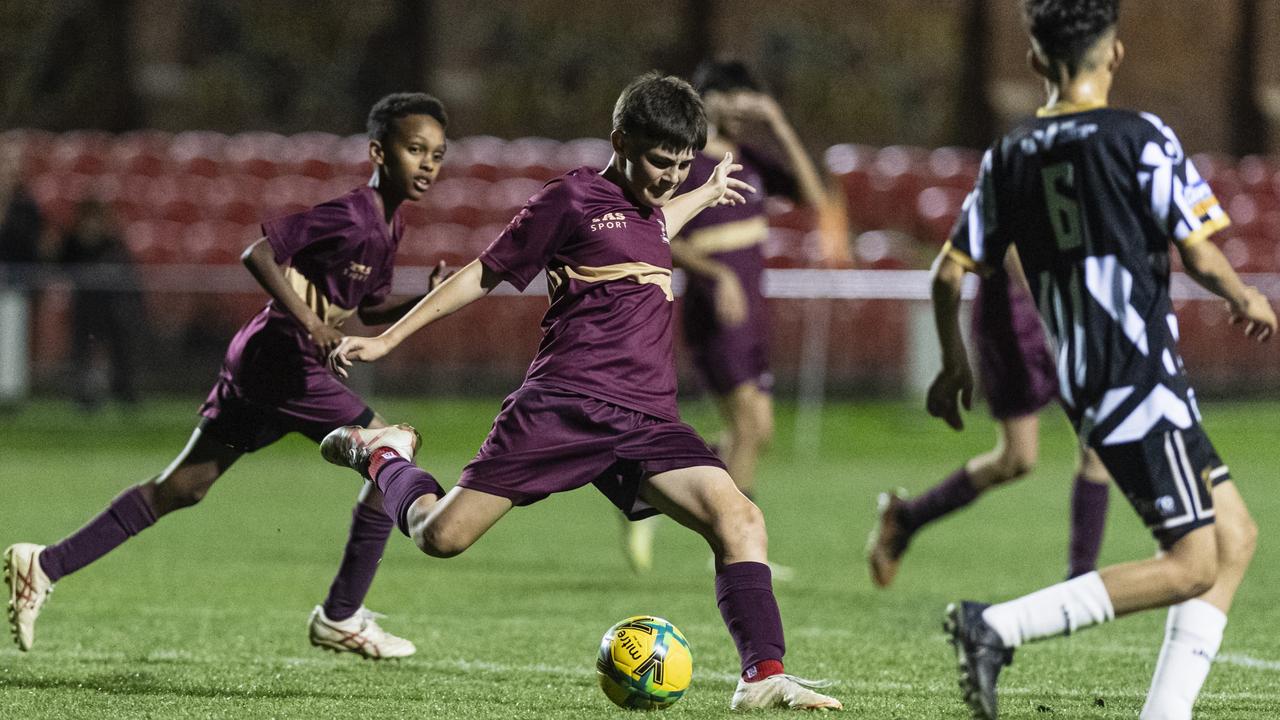 Lachlan Bateman strikes for TAS United against Willowburn in Football Queensland Darling Downs Community Juniors U13 Junior League grand final at Clive Berghofer Stadium, Friday, August 30, 2024. Picture: Kevin Farmer