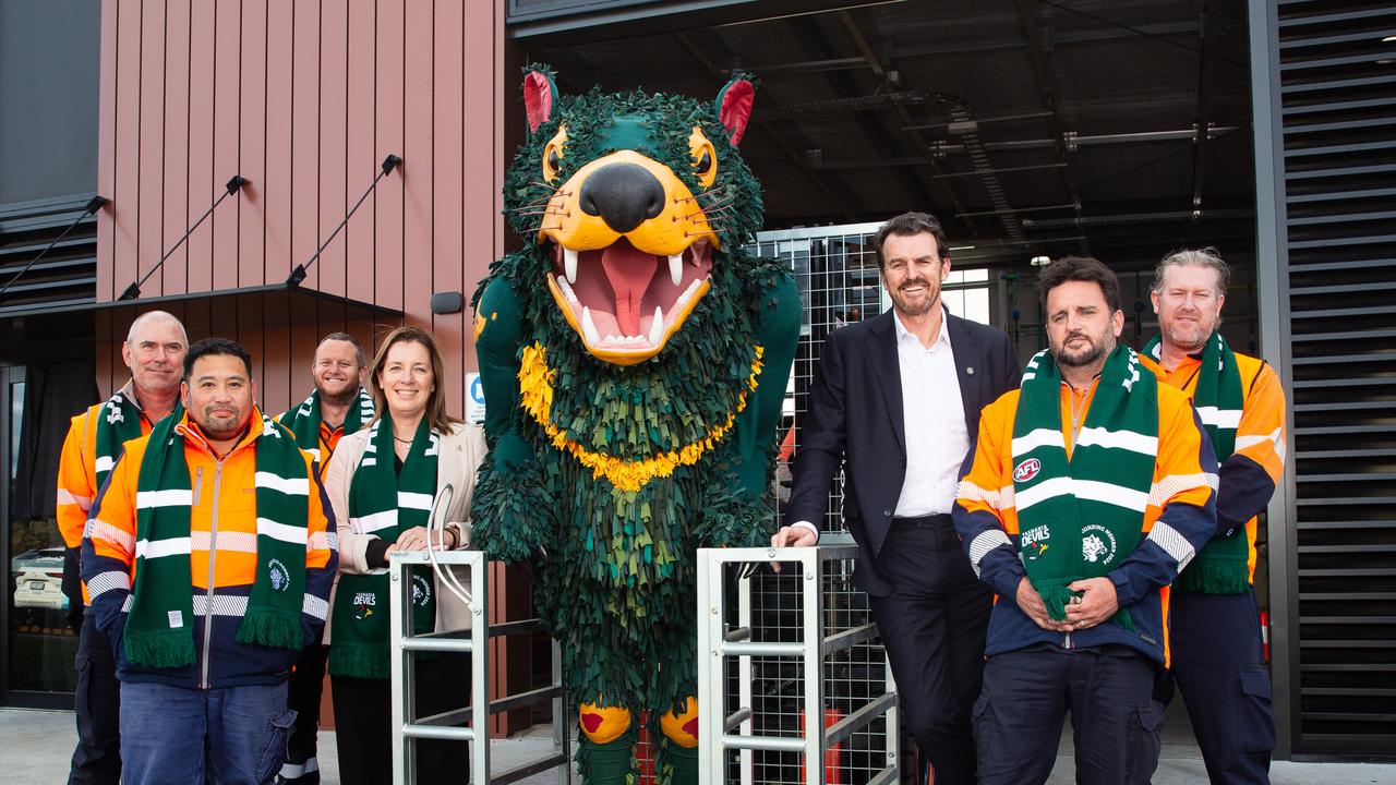 Gale (third from right), the Devils mascot and members of the Master Builders Association. Picture: Linda Higginson