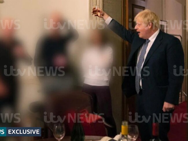 The PM raises a glass of chardy during one of the many lockdown parties held in his offices.