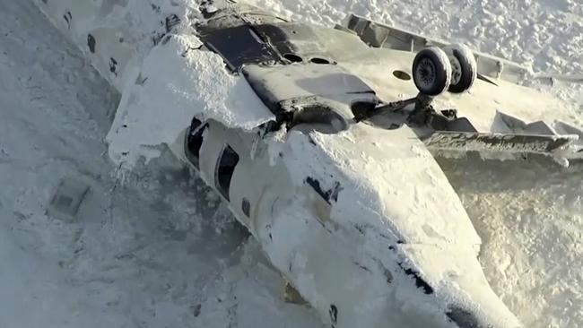 This image taken from video provided by CTV shows an aerial view of the overturned plane at Toronto Pearson Airport, Tuesday, Feb. 18, 2025. (CTV via AP)