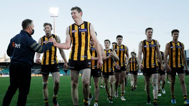 Alastair Clarkson celebrates with Ben McEvoy after the Hawks toppled the Lions.