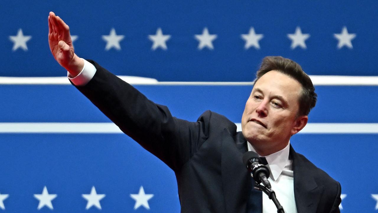 Tesla and SpaceX CEO Elon Musk gestures as he speaks during the inaugural parade inside Capitol One Arena, in Washington, DC, on January 20, 2025. (Photo by ANGELA WEISS / AFP)