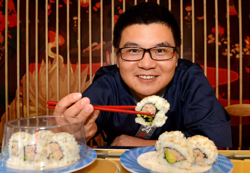 Japanese chef on board sushi train | The Courier Mail