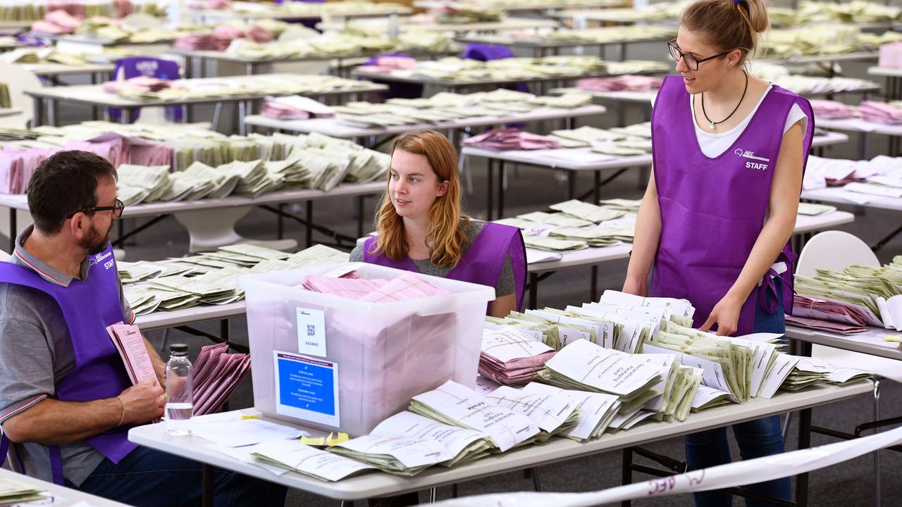 AEC workers sort through absentee ballot papers in 2016. Picture: AFP. William West