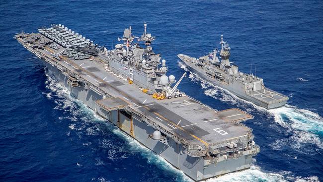 USS America (left) and HMAS Ballarat conduct a replenishment at sea off the coat of Queensland, during Exercise Talisman Sabre 2021. Picture: LSIS Ernesto Sanchez