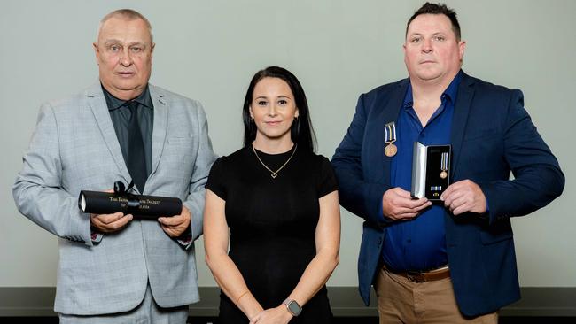 John Clark, Rebecca Ramsey and Steven Apthorp at The Royal Humane Society of Australasia Awards for Bravery at Brisbane City Hall on Friday. Picture: Richard Walker.