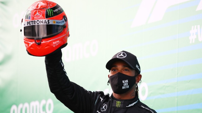 Lewis Hamilton with the Schumacher helmet.