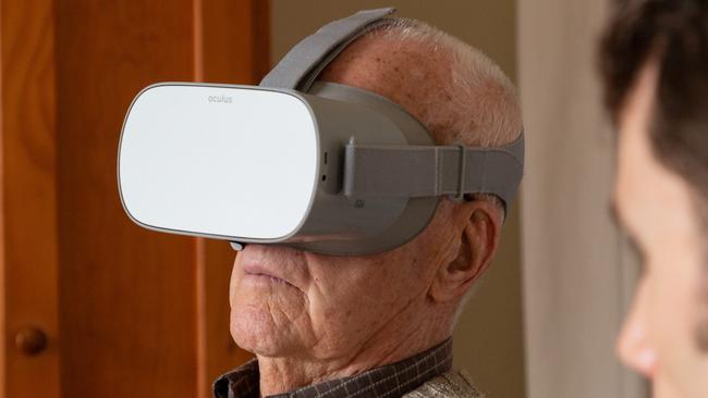 Death Railway veteran James Kerr watches the Anzac360 VR film of Hellfire Pass, at his home in Melbourne with Justin Lees of News360. Picture: Maxim Drygin.