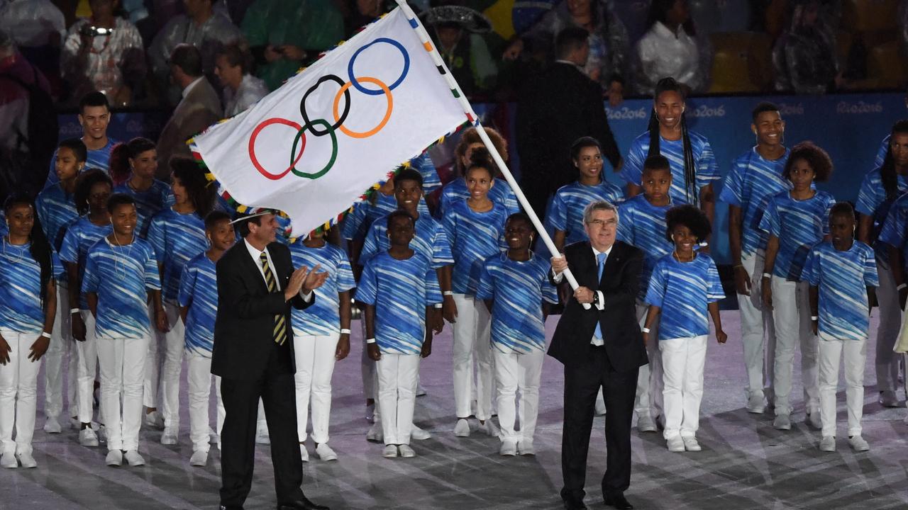 International Olympic Committee President Thomas Bach (centre) takes part in the closing ceremony at Maracana Stadium, on day sixteen of the Rio 2016 Olympic Games. AAP Image/Dean Lewins