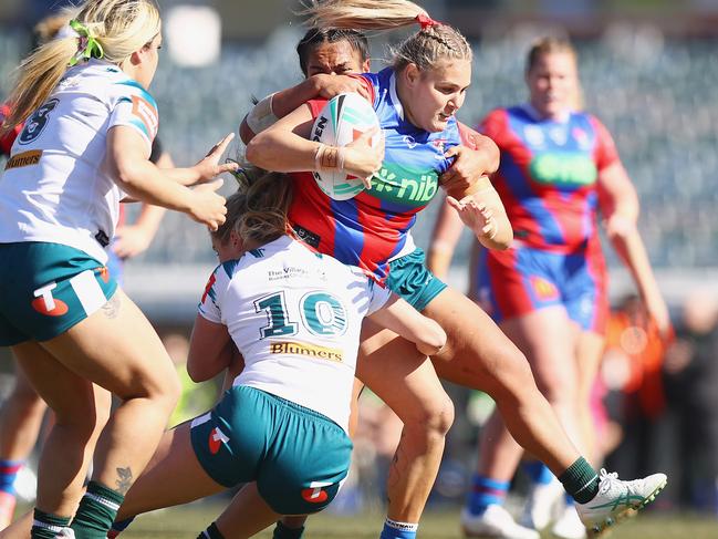 CANBERRA, AUSTRALIA - AUGUST 03: Caitlan Johnston-Green of the Knights is tackled during the round two NRLW match between Canberra Raiders and Newcastle Knights at GIO Stadium on August 03, 2024 in Canberra, Australia. (Photo by Mark Nolan/Getty Images)