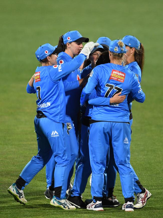 Strikers players celebrate after winning their match against Hobart Hurricanes by two runs at Blundstone Arena on November 23, 2019. Picture: STEVE BELL/GETTY IMAGES