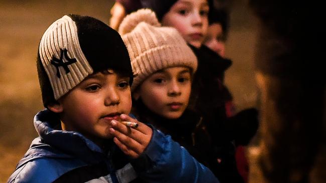 A boy smokes a cigarette in northern Portugal earlier this month, during Christian Epiphany celebrations when children are allowed to smoke. Picture: Patricia De Melo Moreira/AFP