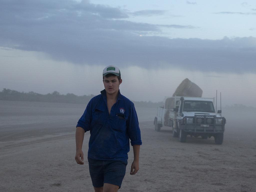 Nicholas Lelievre 15, prepares to feed the family's sheep before dawn on January 16, 2019 in Louth, Australia. Stuart Lelievre, wife Gabbie and their boys, feed all of their sheep due to dire drought conditions. The feeding is time consuming and a financial burden and they are dealing with issues of physical and emotional exhaustion as a result. Apart from the ongoing drought, Gabbie is outraged that her boys don't have access to clean water for showers. She likens it to a third world country. Local communities in the Darling River area are facing drought and clean water shortages as debate grows over the alleged mismanagement of the Murray-Darling Basin. Recent mass kills of hundreds of thousands of fish in the Darling river have raised serious questions about the way WaterNSW is managing the lakes system, and calls for a royal commission. (Photo by Jenny Evans/Getty Images)