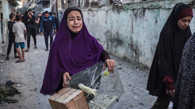 A girl flees following an Israeli strike in Rafah in the southern Gaza Strip where Israel told Palestinians it would be a safe zone. Picture: AFP