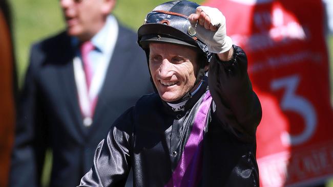 Damien Oliver celebrates after his win on Fiorente in 2013. Picture: Chris Scott