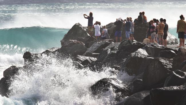 Crowds line the Kirra Groyne. Picture Glenn Hampson