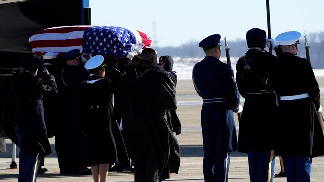 The flag-draped casket of former President Jimmy Carter is carried by a joint services body bearer team to Special Air Mission 39, at Joint Base Andrews, Maryland. Picture: AFP