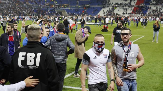 Supporters invade the pitch few minutes before the Europa League quarterfinal
