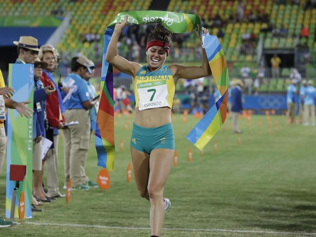 Chloe Esposito of Australia crosses the finish line to win the gold medal in the women’s modern pentathlon.
