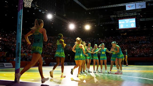 Team Australia walk onto the court during the Netball Gold Medal match between Team Jamaica and Team Australia