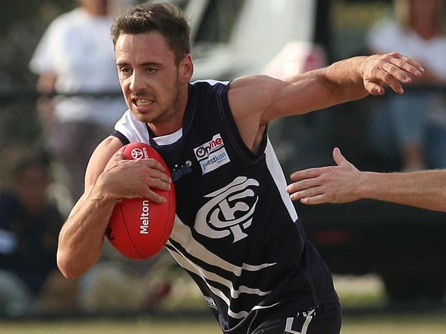 RDFL footy: Melton Centrals v Woodend-Hesket: Izayha Speer of Melton Centrals runs off Dean Bramley of Woodend-HesketSaturday, May 1, 2021, in Harkness, Victoria, Australia. Picture: Hamish Blair