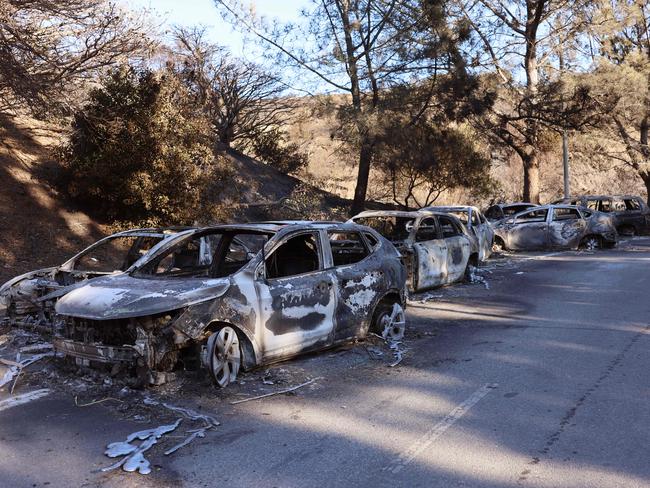 Burned vehicles line a street as the Palisades Fire continues to grow in Los Angeles. Picture: AFP