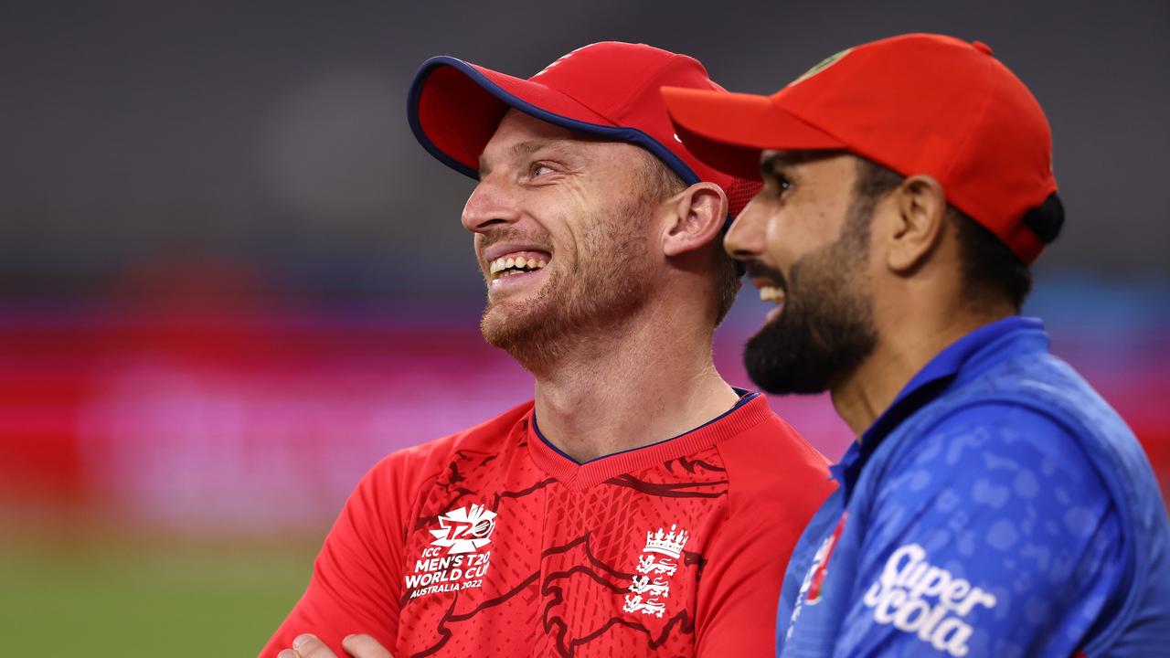 Jos Buttler of England (L) shares a moment with Mohammad Nabi of Afghanistan following the ICC Men's T20 World Cup match between England and Afghanistan at Perth Stadium on October 22, 2022 in Perth, Australia. (Photo by Paul Kane/Getty Images)