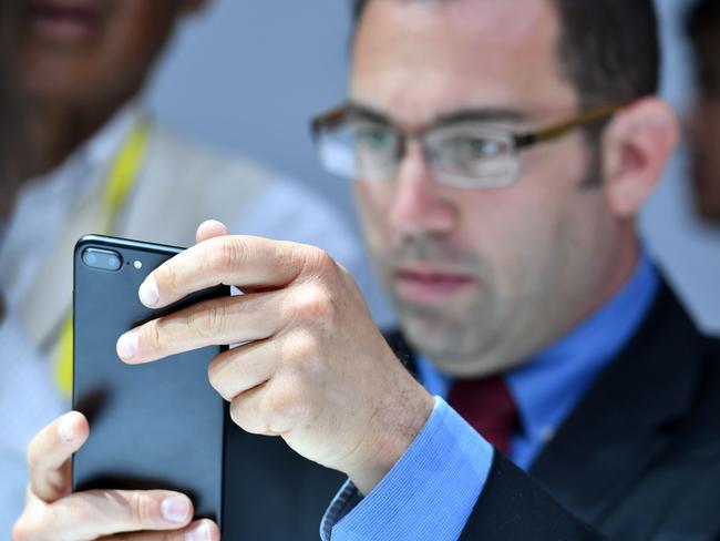 A man tests out an iPhone 7 Plus. Picture: AFP/Josh Edelson