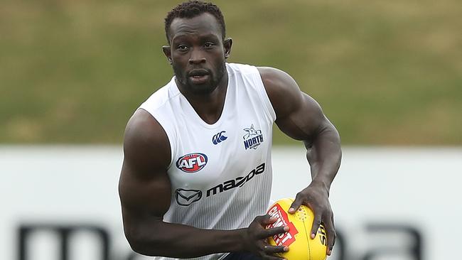 MELBOURNE, AUSTRALIA - DECEMBER 06: Majak Daw of the Kangaroos runs with the ball during a North Melbourne Kangaroos AFL training session at Arden Street Ground on December 06, 2019 in Melbourne, Australia. (Photo by Robert Cianflone/Getty Images)